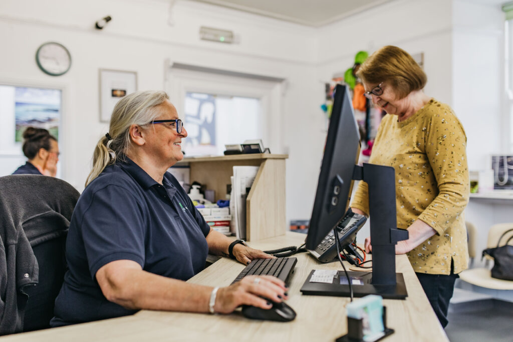 Receptionist welcoming client